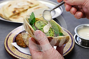 Egyptian falafel served in a pita bread with tahini sauce