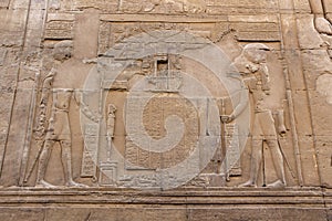 The Egyptian falcon god Horus and Sobek detail on the wall in the Temple of Kom Ombo