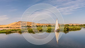 Egyptian feluka, small sailingboat at the baks of river Nile