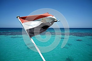 Egyptian flag flies at the stern walking yacht. Red sea.
