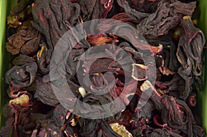 Egyptian hibiscus dry red tea (karkade) background, top view
