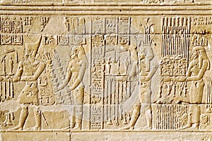 Egyptian hieroglyph. Hieroglyphic carvings on a wall.