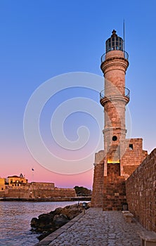 Egyptian Lighthouse of Old Venetian harbour of Chania, Crete, Greece at sunrise. Soft sky from blue to pink, vertical