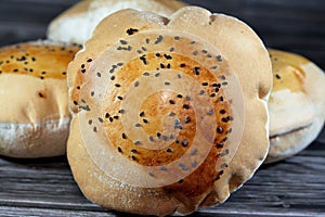 Egyptian Mahlab bread, puff thin, crispy and delicious with black seed baraka seeds on top, made of flour, dry yeast, milk, eggs,