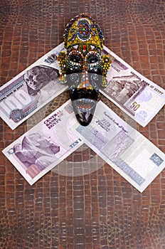 Egyptian mask lies at Egyptian pounds.
