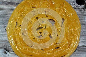 Egyptian Meshabek, It is a rounded sweet made of a deep-fried crunchy batter soaked either in honey or sugar syrup. Its name