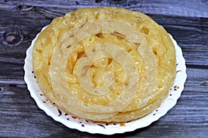 Egyptian Meshabek, It is a rounded sweet made of a deep-fried crunchy batter soaked either in honey or sugar syrup. Its name