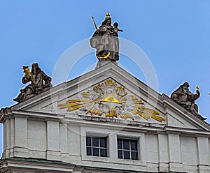 An Egyptian motif with statues along the roofline on a building in Passau Germany photo