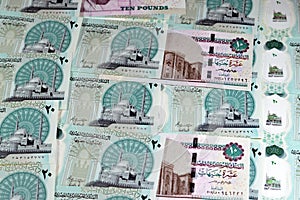 Egyptian new polymer money banknotes cash money bills background of Egyptian 20 EGP LE twenty pounds and old 10 ten pounds