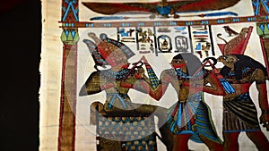 Egyptian papyrus with pharaohs and hieroglyphics representation of gyrating on black background