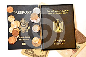 Egyptian passport, Egypt's money banknotes pounds, American passport, USD dollars and coins change, United States of America