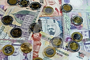 Egyptian pounds cash money banknotes and coins with Saudi Arabia kingdom money bills and coins, Saudi and Egyptian currency