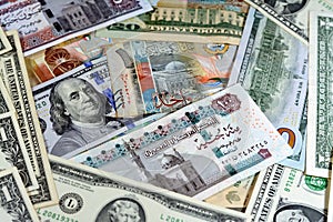 Egyptian pounds currency with American USA dollars cash money banknotes of different values and Kuwait dinars bills, Kuwaiti money