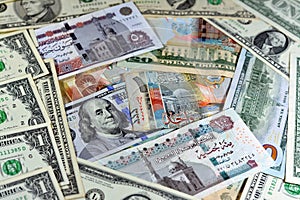 Egyptian pounds currency with American USA dollars cash money banknotes of different values and Kuwait dinars bills, Kuwaiti money
