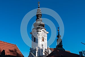 Ehrenhausen - Panoramic aerial view of Ehrenhausen town with the clock tower of the Catholic pilgrimage church