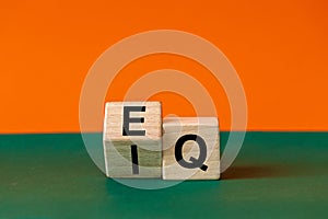 EI or EQ icon. A wooden block with a word showing both the symbol of emotional intelligence and emotional quotient. Beautiful photo