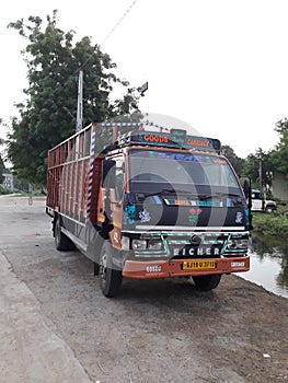 A Eicher Truck is standed next to the canal