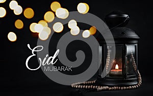 Eid Mubarak Greeting Typography Beautiful Bokeh. Ramadan Candle photo