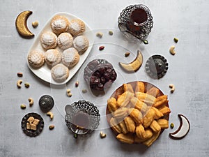 Eid and Ramadan Dates Sweets - Arabian cuisine. Egyptian cookies `Kahk El Eid` and Turkish desserts Tulumba.