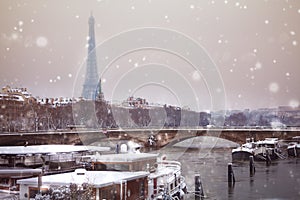 Eifel tower and bridge de l`Alma under snow, Paris