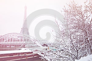 Eifel tower Passerelle Debilly bridge with snow