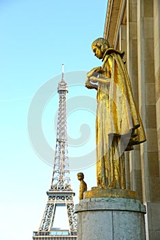 Eiffel tour and statues of Trocadero garden, dating from the 1930s, Paris, France, toned.