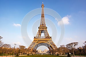 Eiffel tower against blue sky and white clouds in Paris, - morning light