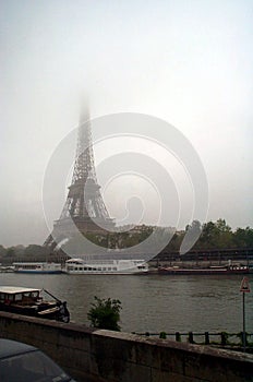 Eiffel tower against cloudy skies