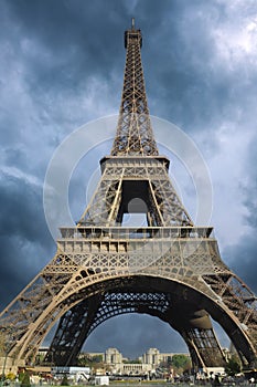 The Eiffel tower against a dramatic sky background.