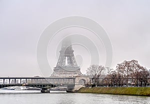 Eiffel Tower and Bir-hakeim bridge on a misty day