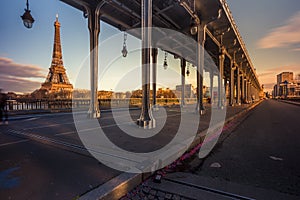 Eiffel Tower from Bir-Hakeim metal bridge at sunset in Paris