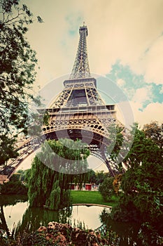 Eiffel Tower from Champ de Mars park in Paris, France. Vintage