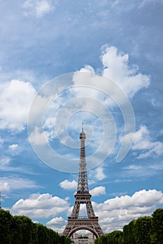 Eiffel tower with clouds. Portrait.