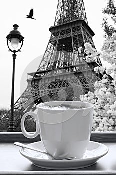 Eiffel Tower with cup of coffee in black and white style, Paris, France photo