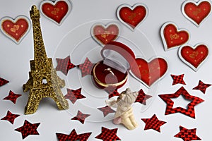 Eiffel tower, cupid and engagement ring. Love concept.