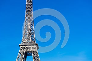 Eiffel tower detail with plane