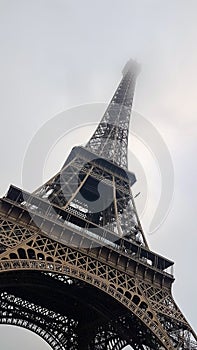 Eiffel Tower in the fog. Paris - France