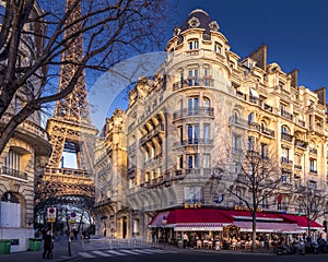 Eiffel tower between haussman buildings in Paris