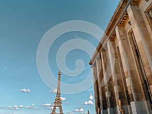 Eiffel tower and the Homme Museum with the background of clouds and the Waning Crescent Moon photo