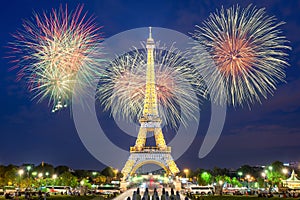 Eiffel tower light performance show and New Year 2017 fireworks in night.