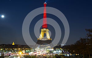 The Eiffel tower lit up with the colors of Belgian National flag