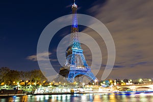 The Eiffel tower lit up in honor of climate talks in Paris, Fran