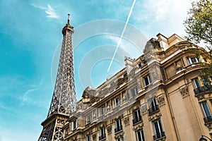 Eiffel Tower and old building in summer.
