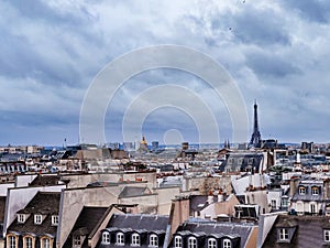 Eiffel tower over old buildings and roofs - Paris panorama