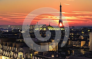 Eiffel tower over the roofs crowd