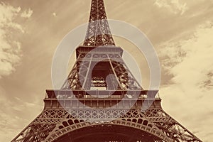 Eiffel Tower in Paris against cloudy sky colored in red with yellow photo
