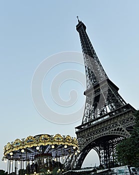 The eiffel tower in Paris and a carrousel.