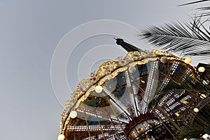 The eiffel tower in Paris and a carrousel.