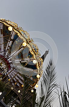 The eiffel tower in Paris and a carrousel.