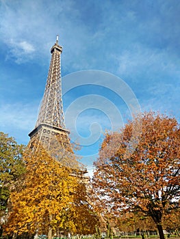 Eiffel Tower of Paris and fall season colors , France in autumn